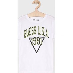 Guess Jeans - Top dziecięcy 118-175 cm. Niebieskie bluzki dziewczęce Guess Jeans, z nadrukiem, z bawełny, z okrągłym kołnierzem, z krótkim rękawem, krótkie, bez kaptura. W wyprzedaży za 69,90 zł.