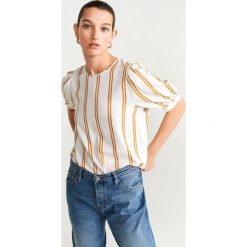 Mango - Bluzka Flunder. Białe bluzki damskie Mango, na co dzień, s, bez wzorów, z wiskozy, eleganckie, z okrągłym kołnierzem, z krótkim rękawem. W wyprzedaży za 79,90 zł.