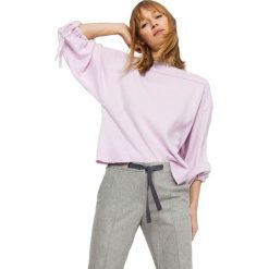 Sweter w kolorze różowym. Różowe swetry damskie Deni Cler, bez wzorów, z bawełny, bez rękawów, bez kaptura. W wyprzedaży za 374,95 zł.