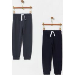 OVS - Spodnie dziecięce 104-140 cm (2-pack). Pomarańczowe spodnie chłopięce OVS, bez wzorów, z bawełny. Za 79,90 zł.