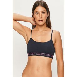 Calvin Klein Underwear - Biustonosz CK One. Białe biustonosze sportowe damskie Calvin Klein Underwear, s, z aplikacjami, z elastanu. Za 129,90 zł.