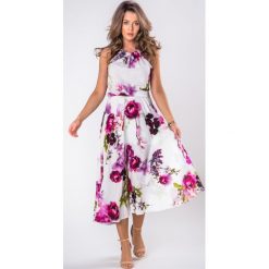 Zwiewna sukienka midi z regulowanym dekoltem typu halter. Sukienki damskie Made in Poland, bez wzorów, z elastanu, bez kołnierzyka, bez rękawów, midi. Za 149,00 zł.