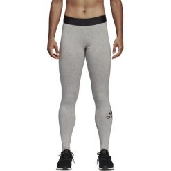 Legginsy adidas Must Haves Badge DU0006. Szare spodnie damskie Adidas, bez wzorów, z bawełny, na fitness i siłownię. Za 119,00 zł.