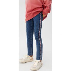 Mango Kids - Jeansy dziecięce Anita 110-164 cm. Zielone jeansy dziewczęce Mango Kids, bez wzorów, z elastanu. Za 99,90 zł.