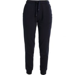 Spodnie sportowe damskie: Napapijri MILLY Spodnie treningowe blu marine