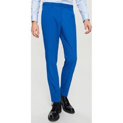 Spodnie garniturowe slim fit - Niebieski. Niebieskie spodnie garniturowe męskie marki Reserved, m, bez wzorów. Za 149,99 zł.