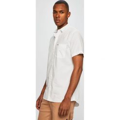 Tommy Jeans - Koszula. Niebieskie koszule męskie Tommy Jeans, m, bez wzorów, z bawełny, klasyczne, z klasycznym kołnierzykiem, z krótkim rękawem. W wyprzedaży za 199,90 zł.