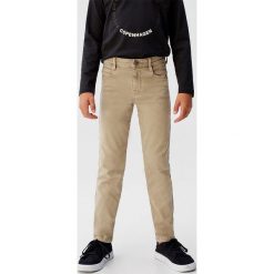 Mango Kids - Spodnie dziecięce Perut 110-164 cm. Niebieskie spodnie chłopięce Mango Kids, bez wzorów, z elastanu. Za 69,90 zł.