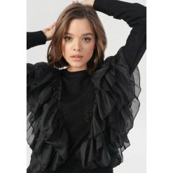 Czarny Sweter Medanea. Czarne swetry damskie Born2be, s, bez wzorów, bez rękawów, bez kaptura. Za 129,99 zł.