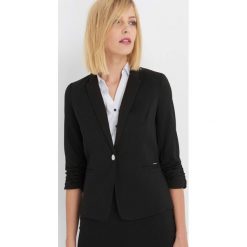 Taliowana marynarka z rękawami 3/4. Czarne marynarki i żakiety damskie Orsay, s, z elastanu. Za 139,99 zł.