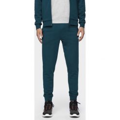 Spodnie dresowe męskie SPMD300 - denim. Spodnie męskie m, z dzianiny. Za 119,99 zł.