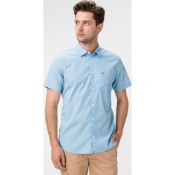 Tommy Jeans Koszula Niebieski. Niebieskie koszule męskie Tommy Jeans, s, bez wzorów, z bawełny, bez kołnierzyka, z krótkim rękawem. Za 307,95 zł.