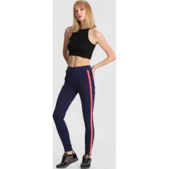 Granatowe Spodnie Instant Warrior. Niebieskie spodnie dresowe damskie other, s, z dresówki. Za 49,99 zł.