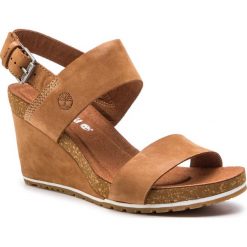 Sandały TIMBERLAND - Capri Sunset Wedge TB0A1PGVF13 Rust Nubuck. Pomarańczowe klapki damskie Timberland, bez wzorów, ze skóry, bez obcasa, na obcasie. Za 449,99 zł.
