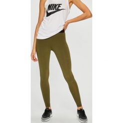 Nike Sportswear - Legginsy. Żółte spodnie damskie marki Nike Sportswear, s, z elastanu. W wyprzedaży za 119,90 zł.