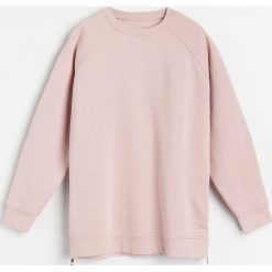 Bluza z ozdobnymi zamkami -. Bluzy damskie Reserved, s, bez wzorów, bez rękawów, bez kaptura. Za 69,99 zł.