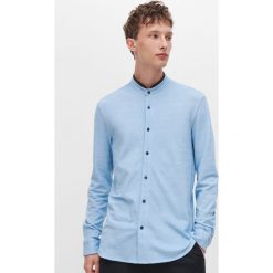 Koszula ze stójką - Niebieski. Niebieskie koszule męskie Reserved, xl, bez wzorów, ze stójką, bez rękawów. W wyprzedaży za 59,99 zł.