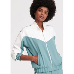 Rozpinana bluza ze stójką - Zielony. Zielone bluzy damskie Reserved, bez wzorów, bez rękawów, bez kaptura. Za 119,99 zł.