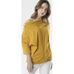 Żółta Bluzka Doriedah. Żółte bluzki damskie Born2be, xl, bez wzorów, bez kołnierzyka, bez rękawów. W wyprzedaży za 54,99 zł.