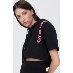 Bluzka z kapturm Gym Hero - Czarny. Czarne bluzki damskie Sinsay, s, bez wzorów, bez kołnierzyka, bez rękawów. Za 24,99 zł.