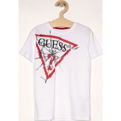 Guess Jeans - T-shirt dziecięcy 118-175 cm. Białe t-shirty chłopięce Guess Jeans, z nadrukiem, z bawełny, bez rękawów. W wyprzedaży za 59,90 zł.