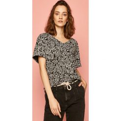 Medicine - T-shirt by Keith Haring. Czarne bluzki damskie MEDICINE, s, z nadrukiem, z bawełny, casualowe, bez kołnierzyka. W wyprzedaży za 47,90 zł.