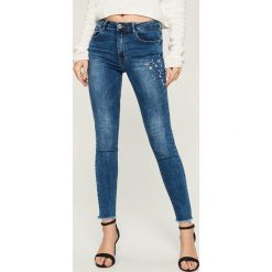 Odzież damska: Jeansy SKINNY z kryształkami - Niebieski
