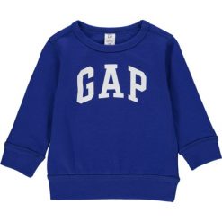 Bluza w kolorze niebieskim. Niebieskie bluzy niemowlęce Gap Kids, z nadrukiem, bez rękawów, bez kaptura. W wyprzedaży za 65,95 zł.