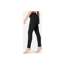 Spodnie dresowe Gym & Pilates 560 damskie. Czarne spodnie damskie DOMYOS, xs, z elastanu. Za 84,99 zł.