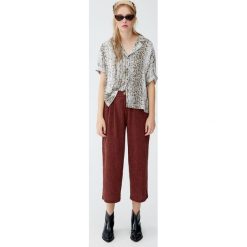 Spodnie culotte z muślinu. Szare spodnie damskie Pull&Bear. Za 79,90 zł.