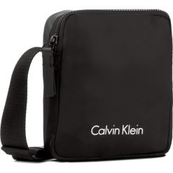 Saszetka CALVIN KLEIN - Blithe Reporter K50K503446 001. Czarne torby męskie skórzane marki Calvin Klein, bez wzorów, ze skóry ekologicznej, młodzieżowe. W wyprzedaży za 269,00 zł.