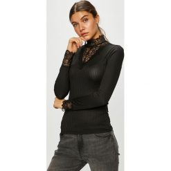 Jacqueline de Yong - Bluzka Rine. Czarne bluzki damskie Jacqueline de Yong, s, bez wzorów, z elastanu, casualowe, z golfem, bez rękawów. Za 89,90 zł.