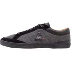 Le coq sportif FERETCRAFT 2 TONES Tenisówki i Trampki black/tan. Czarne tenisówki damskie marki le coq sportif, ze skóry ekologicznej. W wyprzedaży za 134,50 zł.