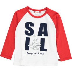 Koszulka "Tyler 306" w kolorze biało-czerwonym. Białe t-shirty chłopięce marki LEGO Wear, z aplikacjami, z bawełny, z długim rękawem. W wyprzedaży za 45,95 zł.