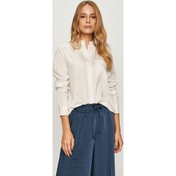 Calvin Klein Jeans - Koszula. Białe koszule damskie Calvin Klein Jeans, na co dzień, s, bez wzorów, z lyocellu, klasyczne, z klasycznym kołnierzykiem, z długim rękawem. Za 359,90 zł.