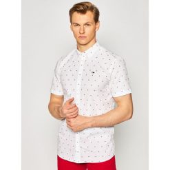 Koszula Tommy Jeans Dobby DM0DM08127. Niebieskie koszule męskie Tommy Jeans, s, bez wzorów, z bawełny, casualowe, bez kołnierzyka, bez rękawów. Za 279,00 zł.