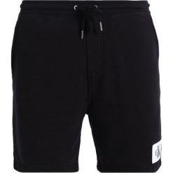 Calvin Klein Jeans HOMEROS SLIM Spodnie treningowe black. Czarne jeansy męskie slim marki Calvin Klein Jeans. Za 299,00 zł.