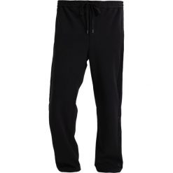Topman WIDE Spodnie treningowe black. Czarne bez kategorii Topman, z elastanu. W wyprzedaży za 179,10 zł.