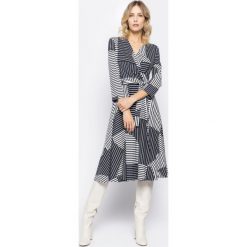 Sukienka koktajlowa Sportmax Code Acqua 56210507. Niebieskie sukienki damskie Sportmax Code, xs, bez wzorów, z elastanu, wizytowe, bez kołnierzyka, bez rękawów. W wyprzedaży za 629,00 zł.