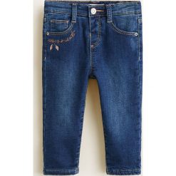 Mango Kids - Jeansy dziecięce Dudesg 80-104 cm. Niebieskie rurki dziewczęce marki Mango Kids, z aplikacjami, z bawełny. Za 79,90 zł.