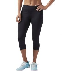 LEGGINSY WORKOUT READY CAPRI (M). Legginsy sportowe damskie Reebok, s, bez wzorów, ze skóry, do biegania. Za 149,99 zł.