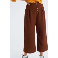 Materiałowe spodnie culotte - Brązowy. Pomarańczowe spodnie damskie marki Cropp, z tkaniny. Za 89,99 zł.