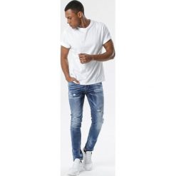 Niebieskie Jeansy Murierien. Niebieskie jeansy męskie Born2be, m, z aplikacjami, długie. Za 79,99 zł.