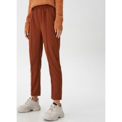 Spodnie typu jogger - Brązowy. Pomarańczowe spodnie damskie House, s. Za 89,99 zł.