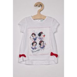 Blukids - Top dziecięcy Disney 74-98 cm. Białe bluzki dziewczęce Blukids, z nadrukiem, z bawełny, z okrągłym kołnierzem, z krótkim rękawem, krótkie, bez kaptura. W wyprzedaży za 29,90 zł.