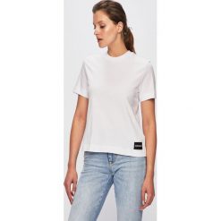 Calvin Klein Jeans - Top. Pomarańczowe bluzki damskie Calvin Klein Jeans, s, bez wzorów, z bawełny, z okrągłym kołnierzem. Za 169,90 zł.