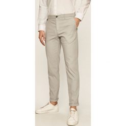 Tommy Hilfiger Tailored - Spodnie. Szare spodnie męskie Tommy Hilfiger Tailored, bez wzorów, z elastanu. Za 579,90 zł.