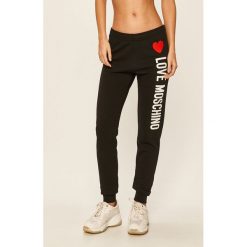 Love Moschino - Spodnie. Czarne legginsy damskie Love Moschino, m, z nadrukiem, z elastanu. W wyprzedaży za 599,90 zł.