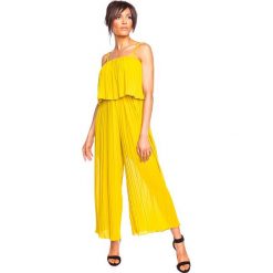 Kombinezon "Nale" w kolorze żółtym. Żółte kombinezony damskie Glamour Paris, s, bez wzorów, bez kołnierzyka, bez rękawów. W wyprzedaży za 153,95 zł.