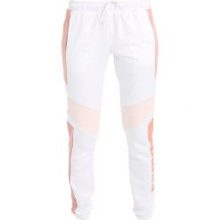 Spodnie dresowe damskie: Puma ARCHIVE PANT Spodnie treningowe peach beige